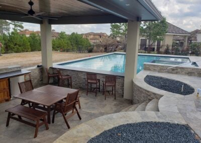 Snyder custom home backyard lowered patio by pool
